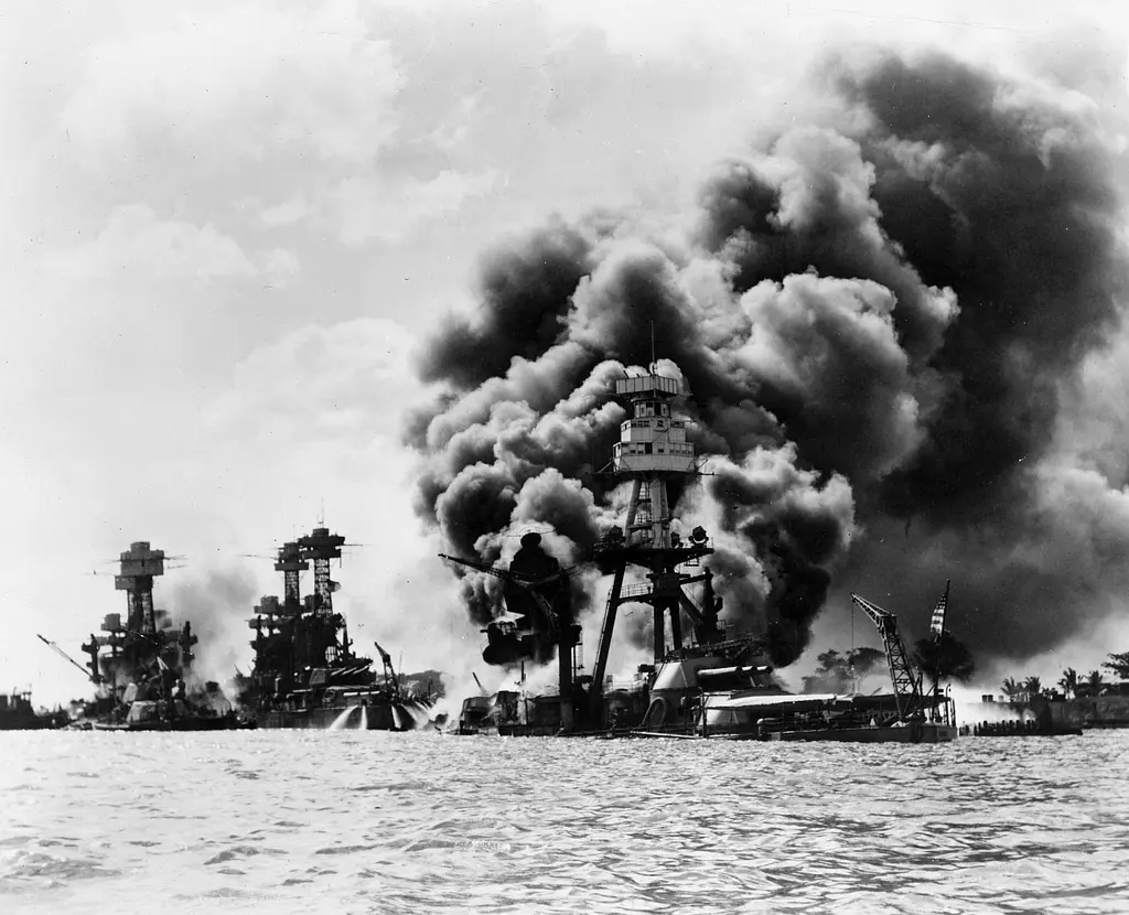 Battleships sinking during pearl harbour attacks.